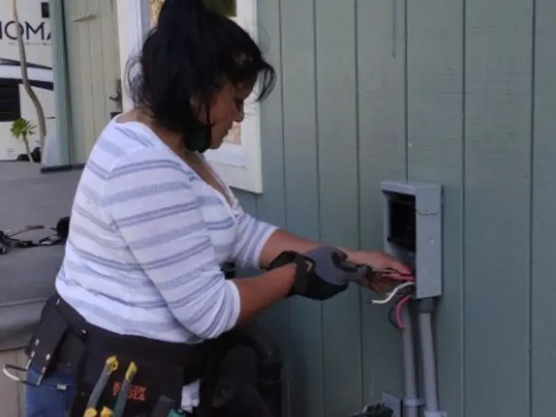 Licensed electrician wiring an exterior subpanel in Millersburg
